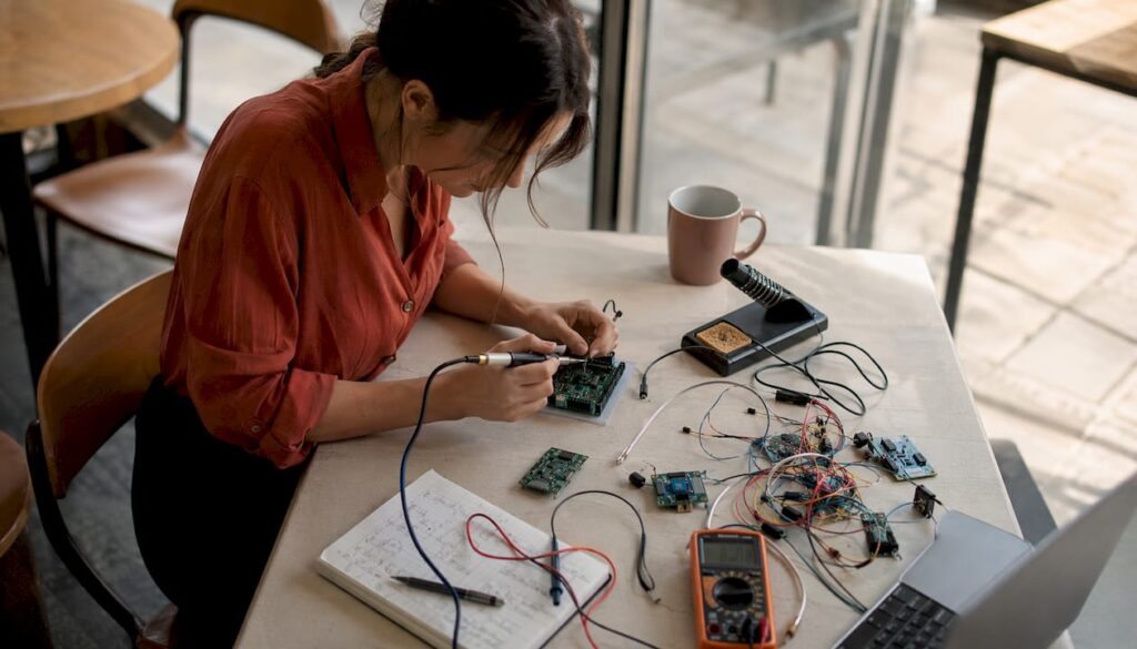 Engineer assembling embedded hardware in home office